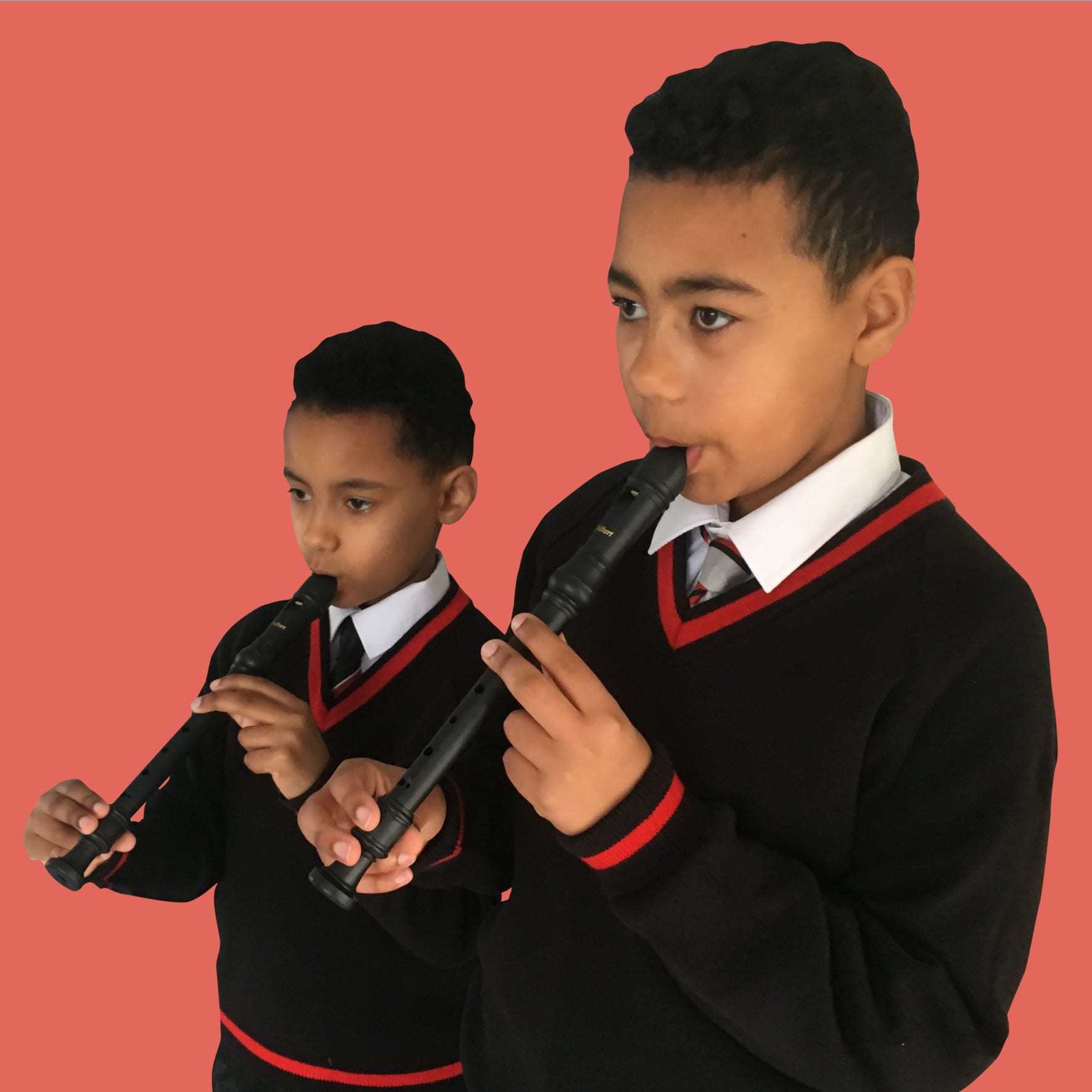 two young people playing the recorder
